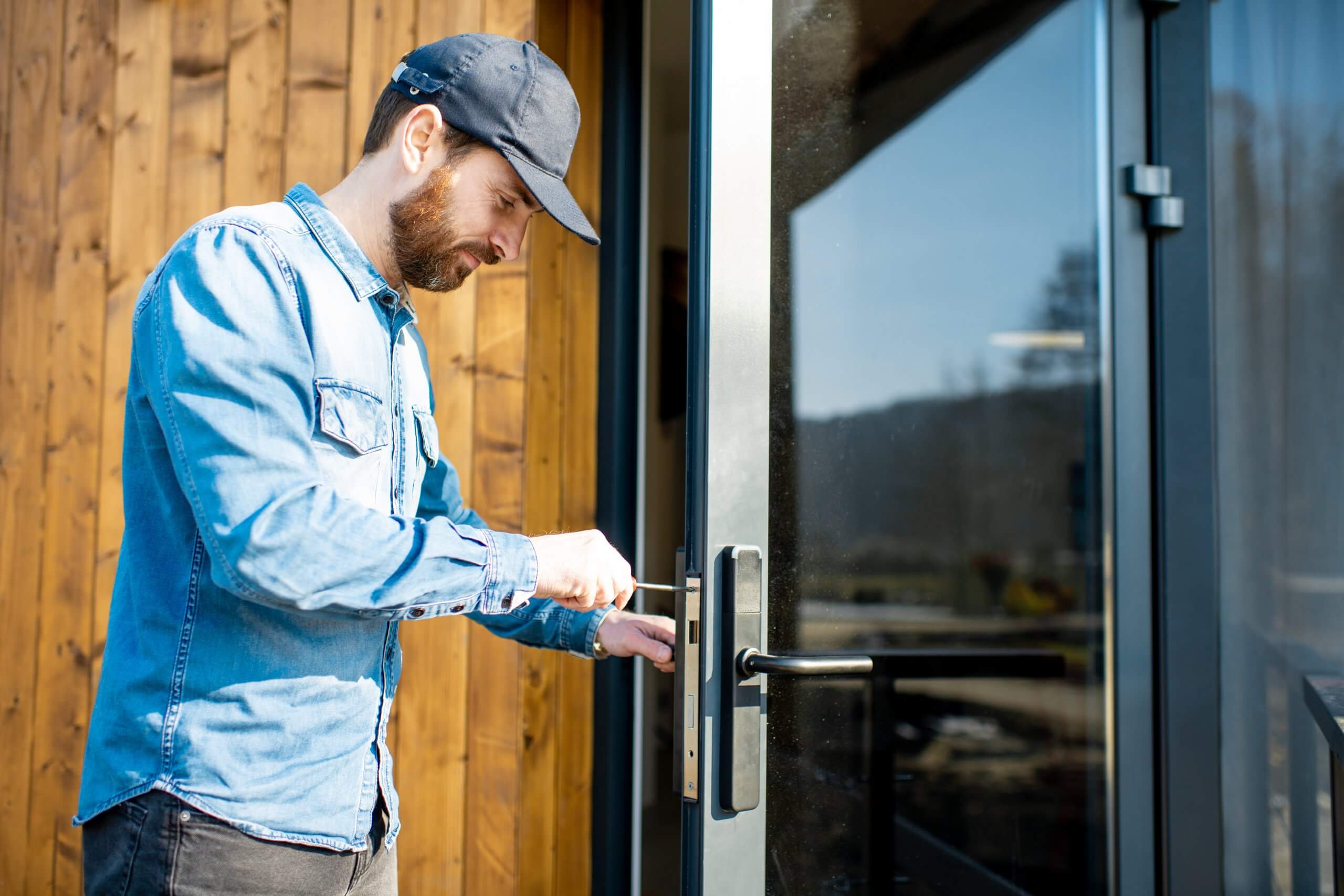 Workman,Repairing,Entrance,Door,Lock,Of,The,Modern,House,Or