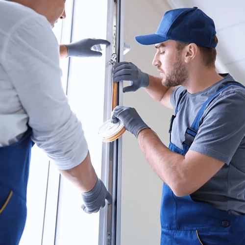 Men replacing weatherstripping